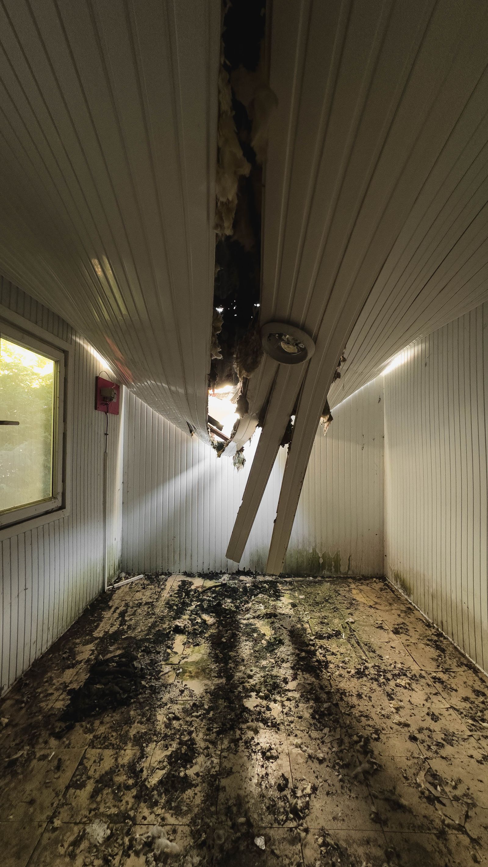 Water-damaged San Jose home interior with ceiling leak and standing water